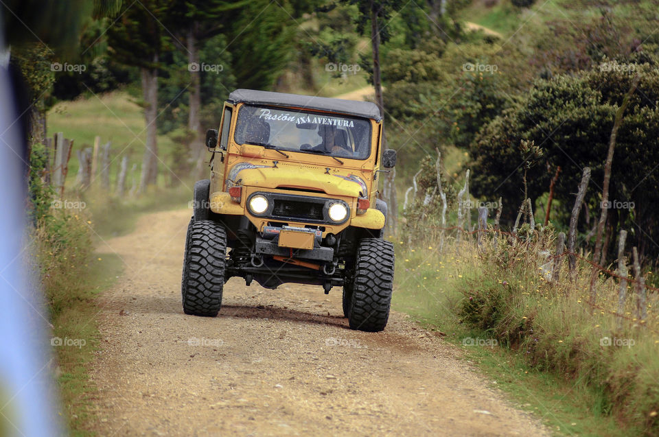 Cherokee jeep rally in sand field .