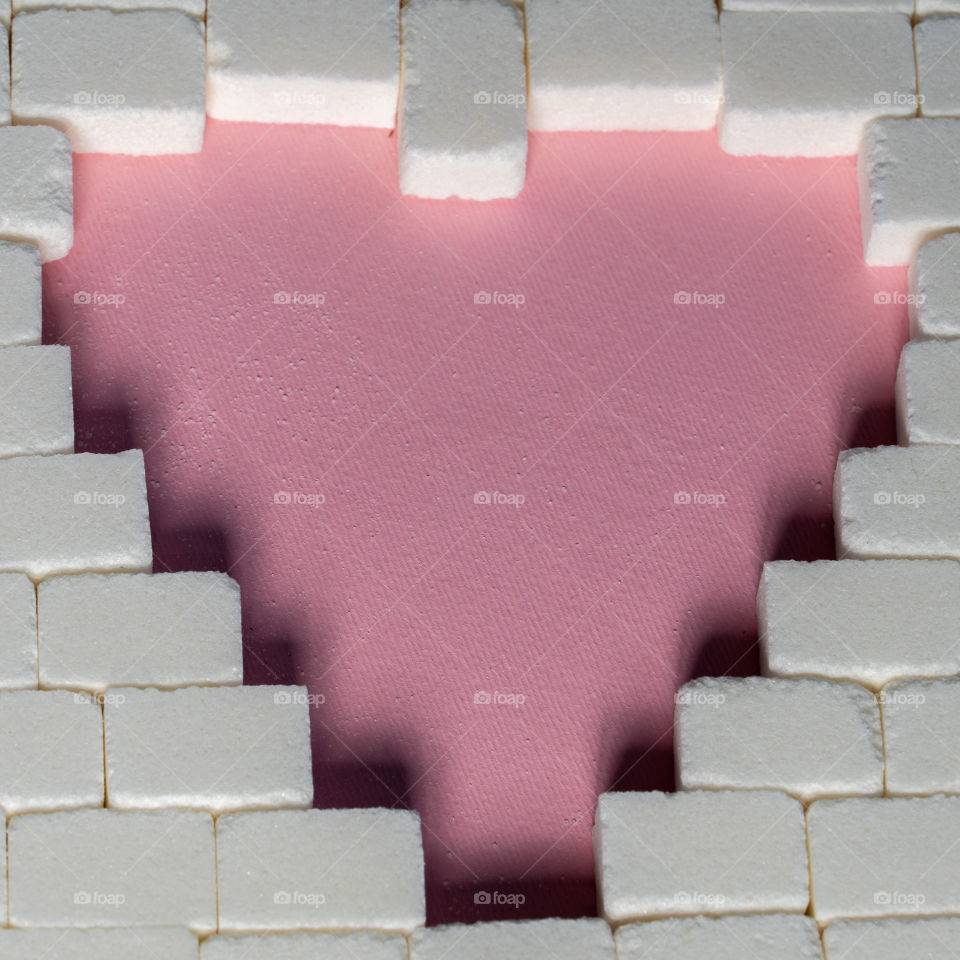 Sugar cubes in heart shape. Creative valentine concept