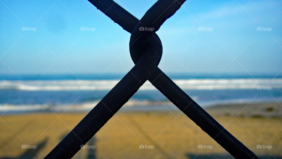 A fence... and  an amazing sunny California beach!!!! 