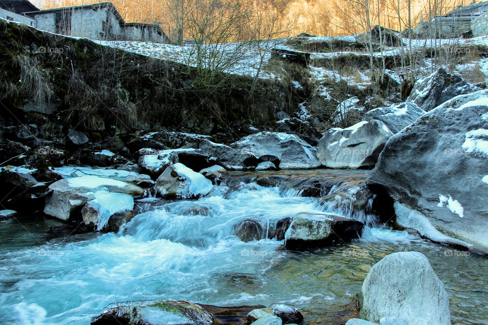 Landscape view of water in winter season. Sondrio, Italy