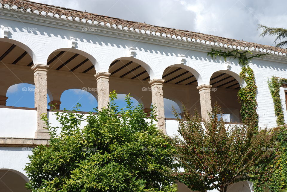 White building with arch in moorish style architecture. The Alhambra.