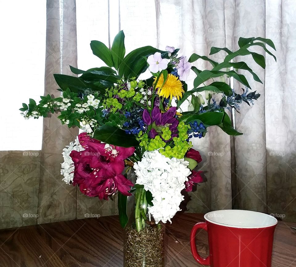 The scent of lilacs and Lily of valley fills the air.