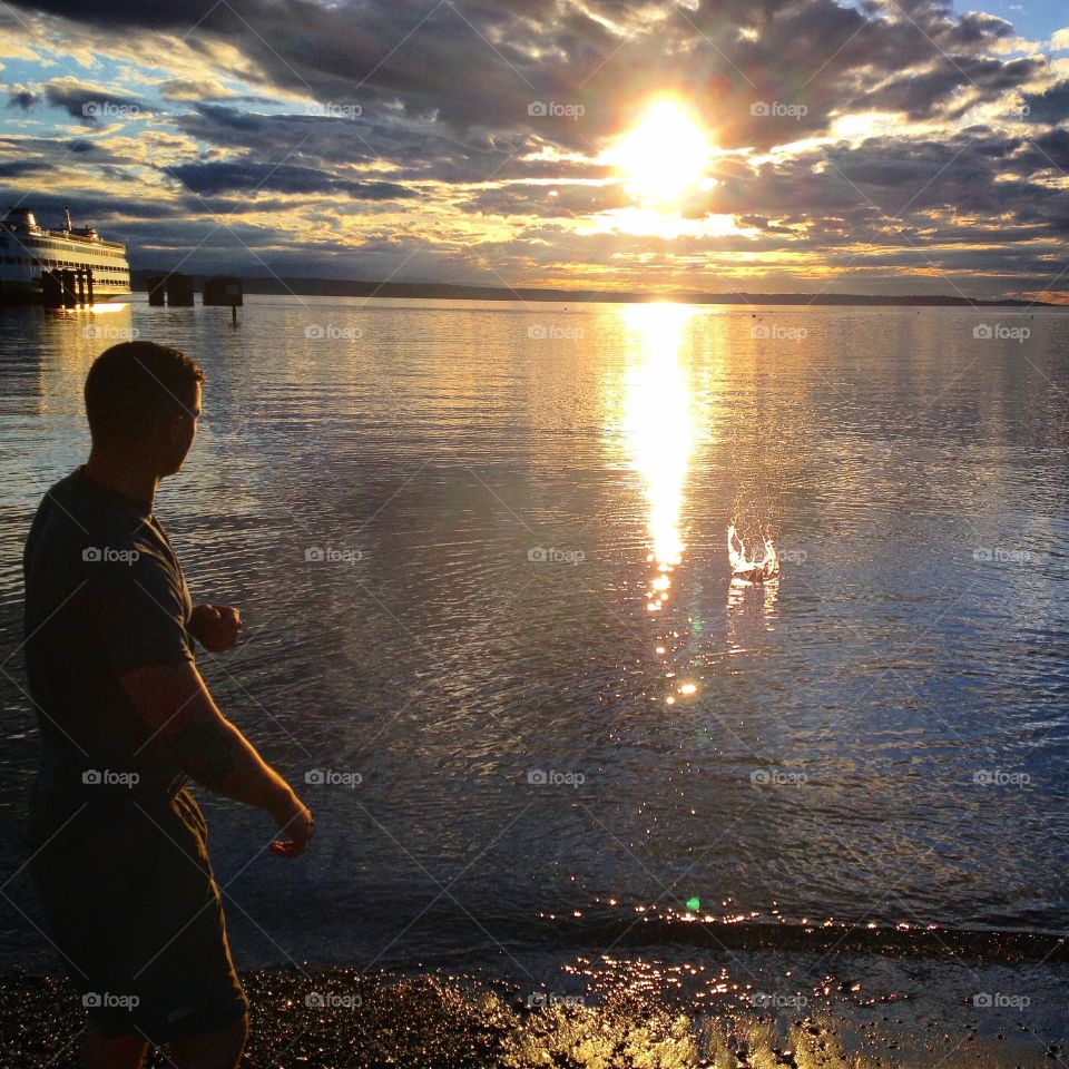Skipping rocks on the Puget Sound at sunset