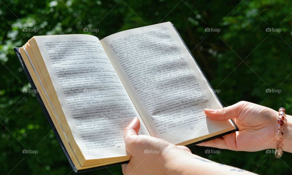 book in the hand, reading book, geometric shapes rectangle