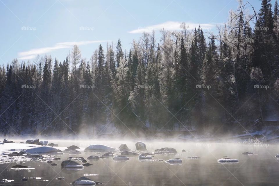 Hot springs on snow-capped mountains in Xinjiang, China