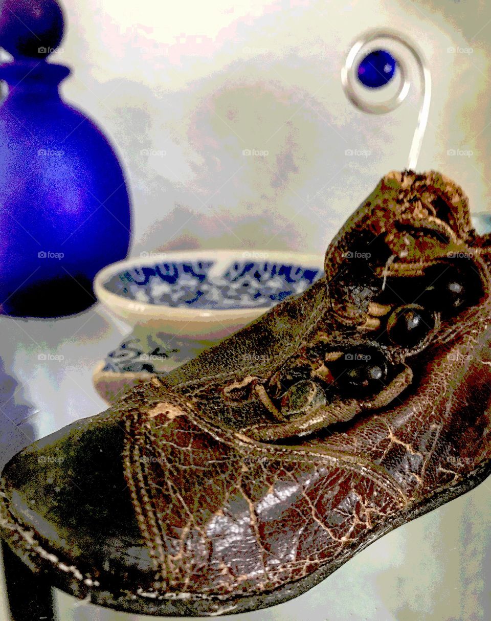 Antique baby shoe in focus 
