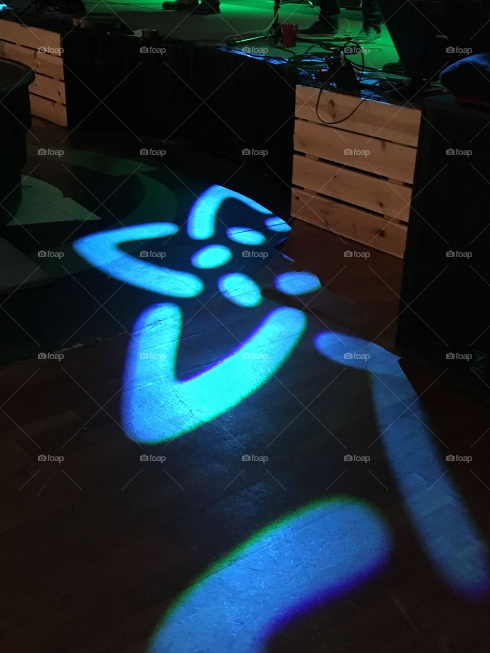 Flower light on a wooden floor at our church!. Constant movement on the floor walls and ceiling.