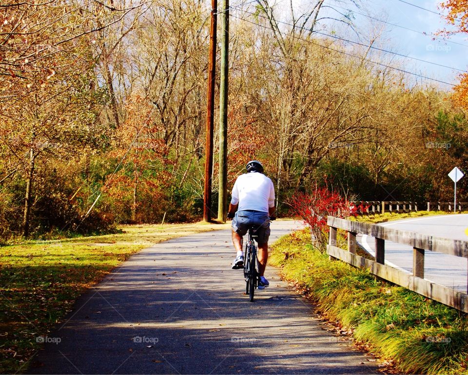 Man riding on bike trail. Man riding on a bike trail