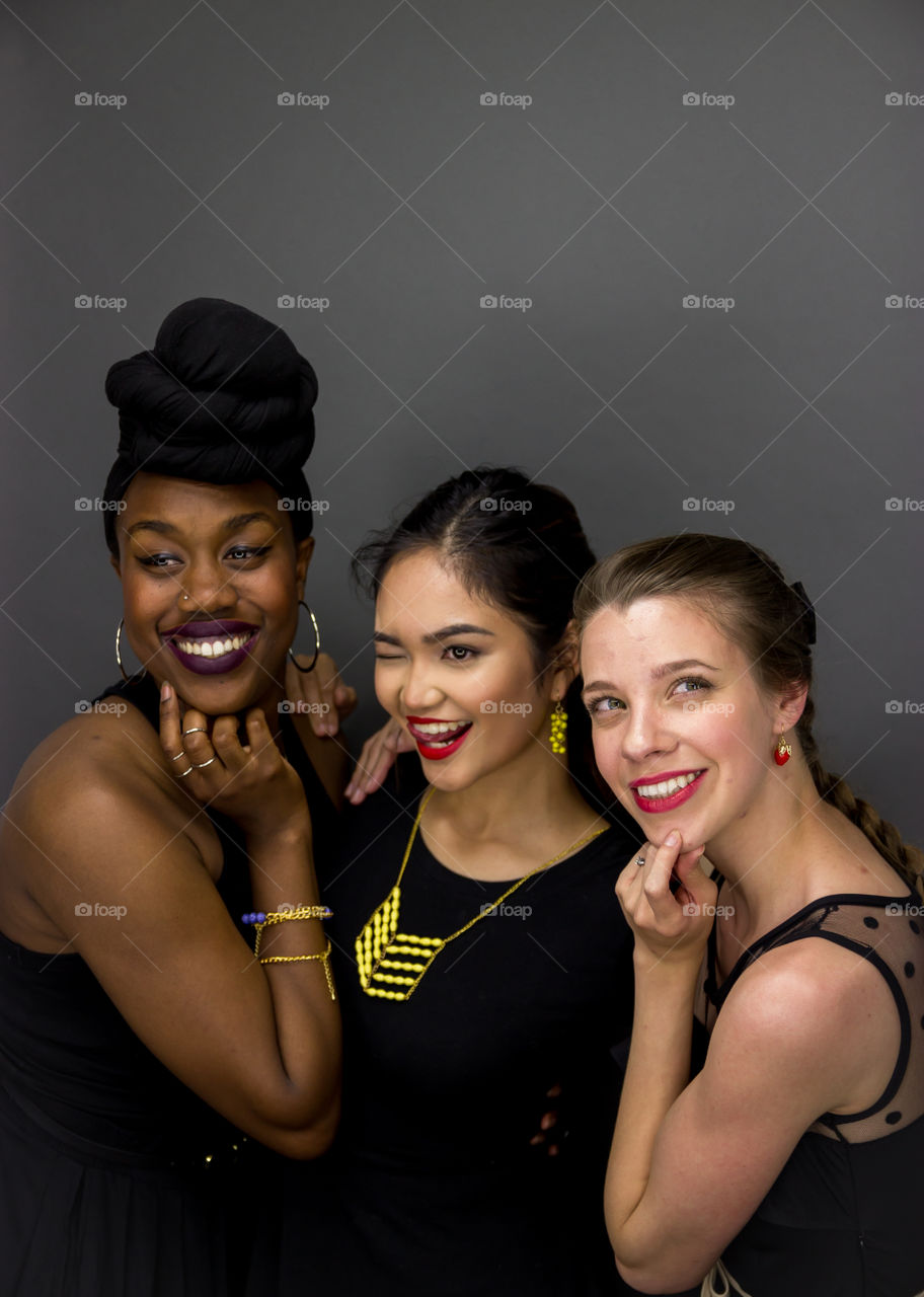 Three models having fun during a modeling event 