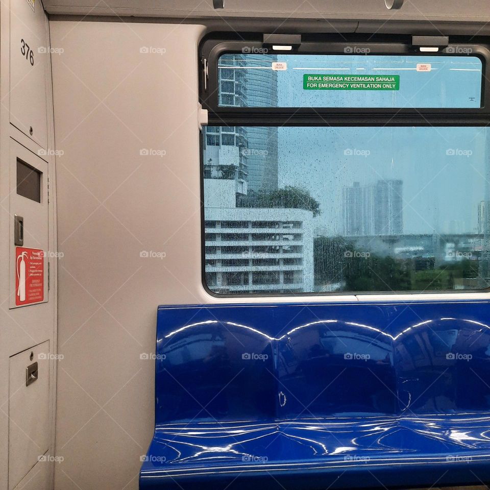 empty lrt train seats ride raining