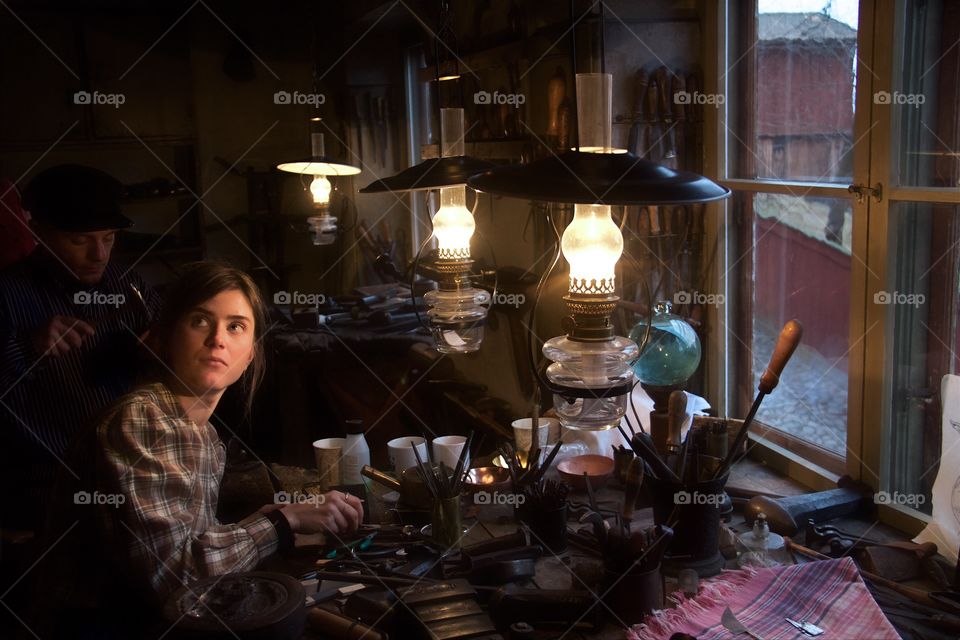 Young woman working with hand tools