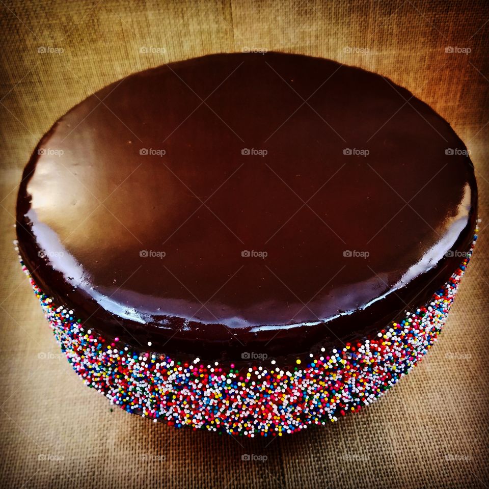 chocolate glazed, color sprinkles  cheesecake