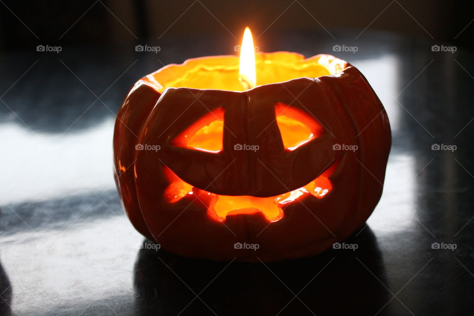 Ceramic candlelight in shape of a jack-o-lantern