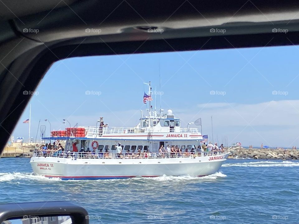 A commercial fishing boat named Jamaica II heads out of the Manasquan inlet toward the Atlantic Ocean. I took the photo through the window of my Jeep while parked at the inlet parking lot in Point Pleasant Beach, NJ. It’s a great place to chill.
