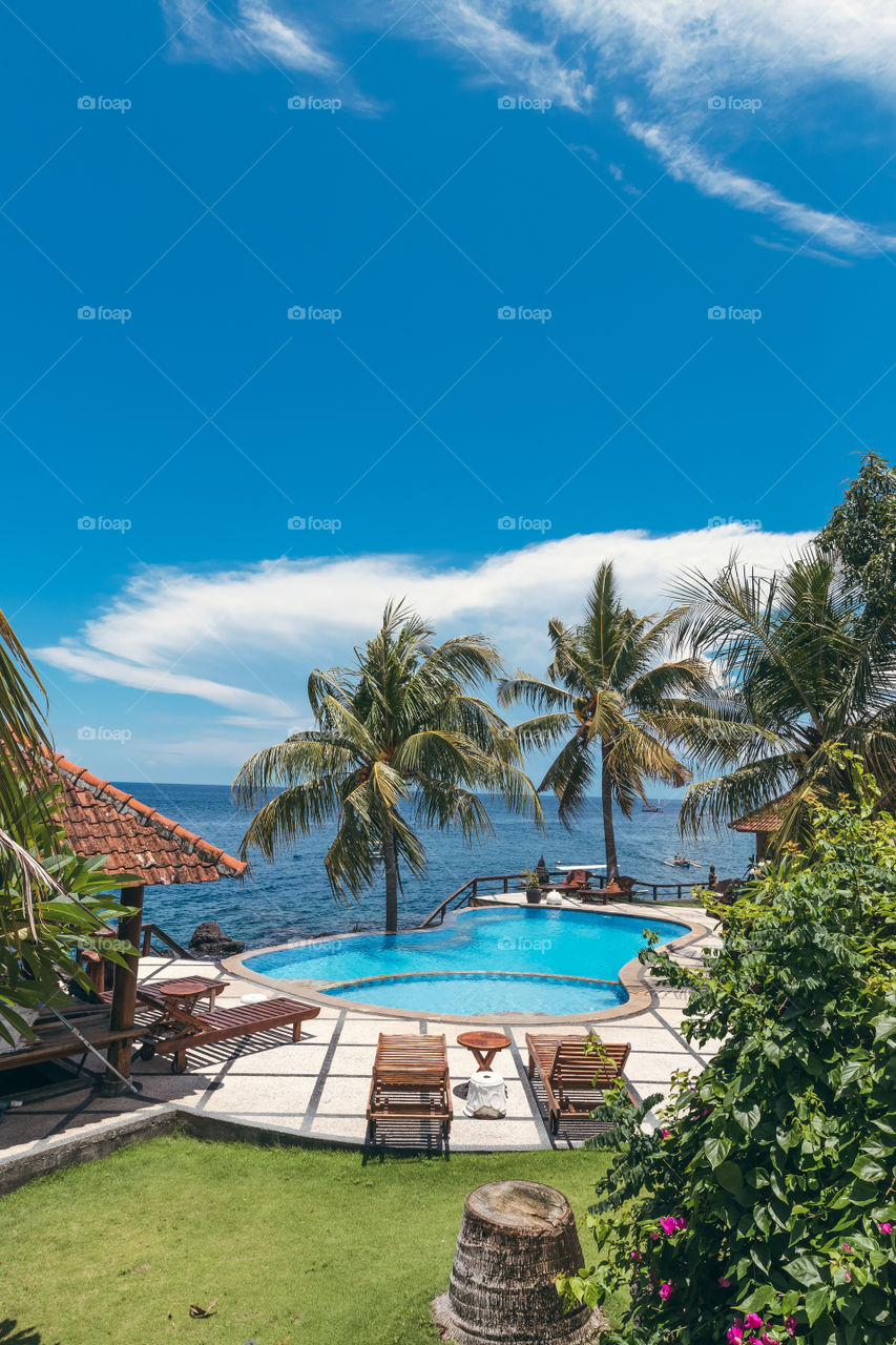 Tropic pool overlooking the Indian Ocean. Bali island, Indonesia. 