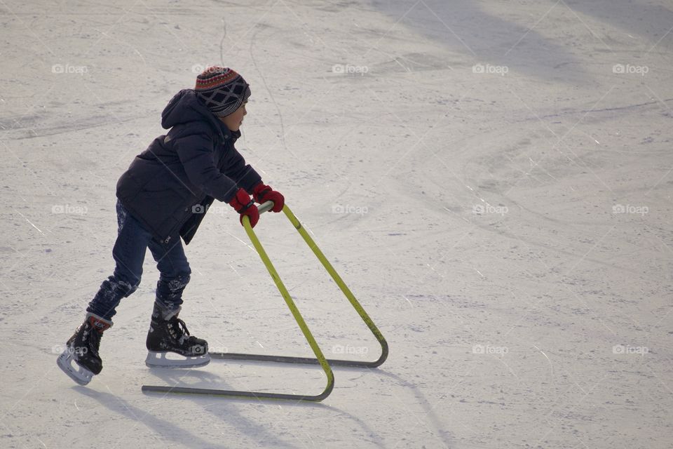 Kid on ice rink