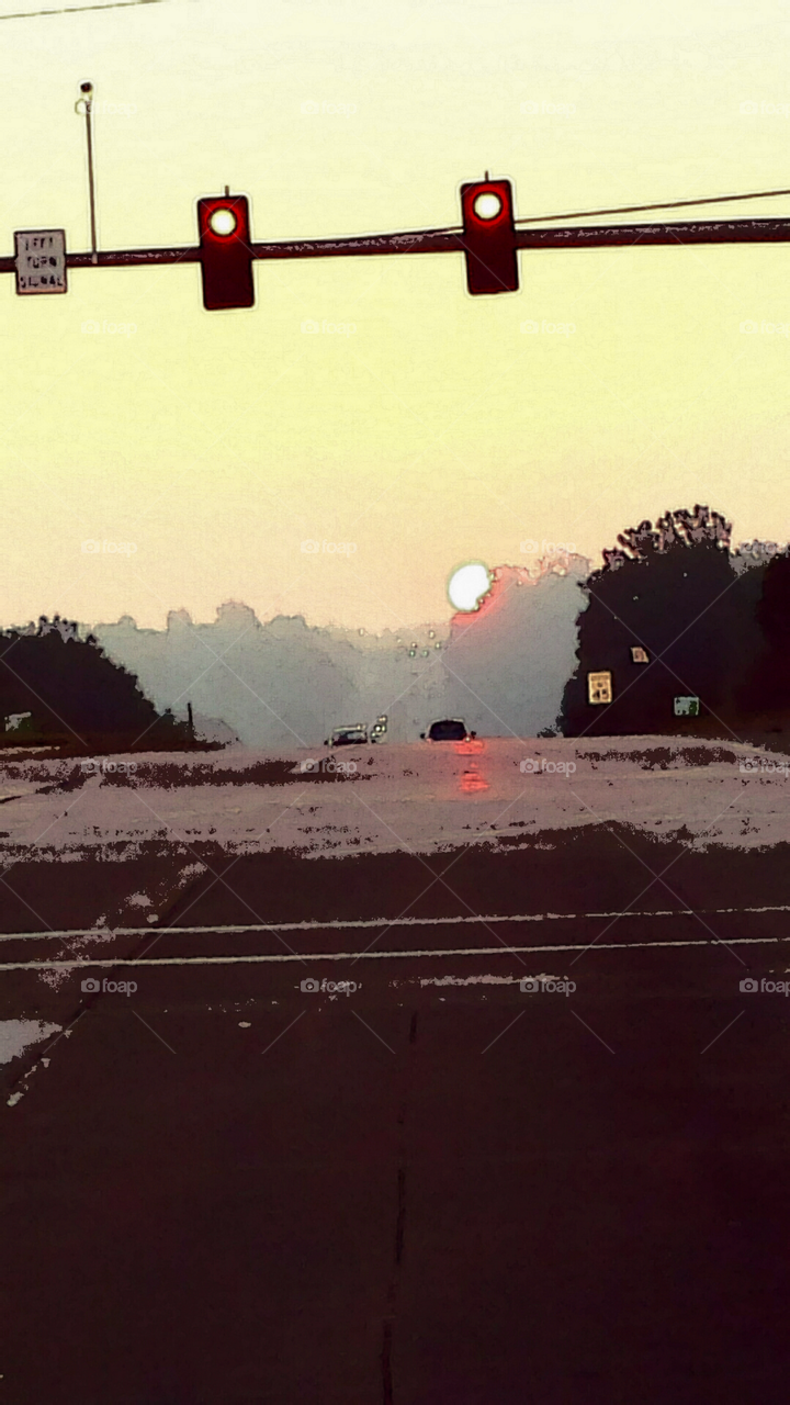 Sunrise on the Street. I clicked this pic on my way to work one morning. I used filters to tweak it later.