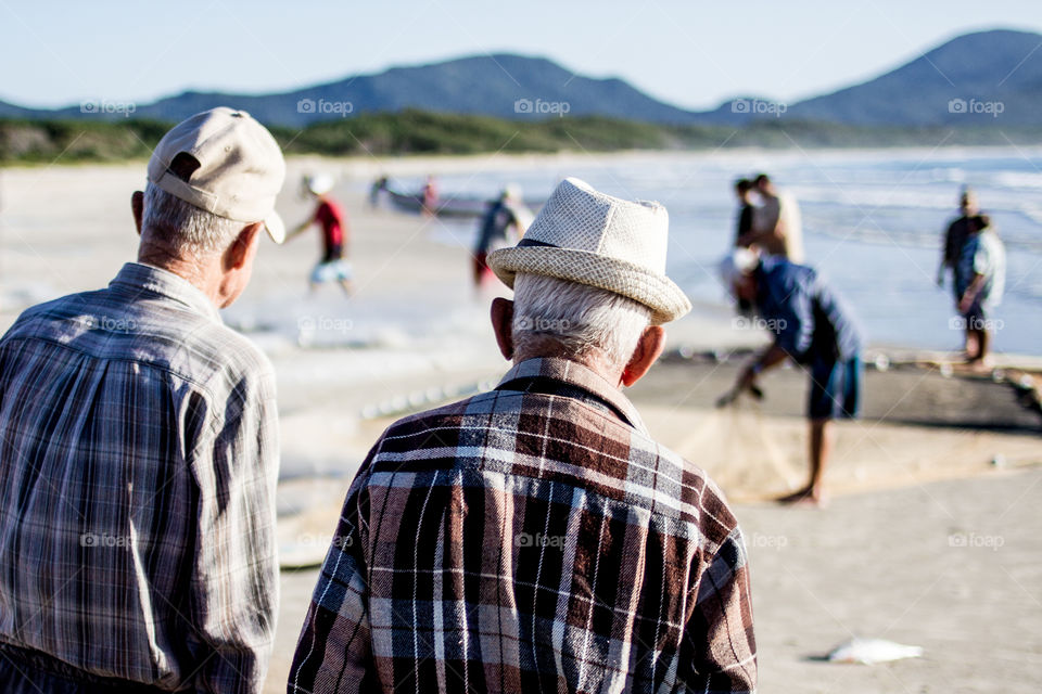 Experienced watching fisherman