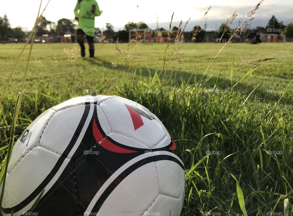 Boy running for a soccer ball