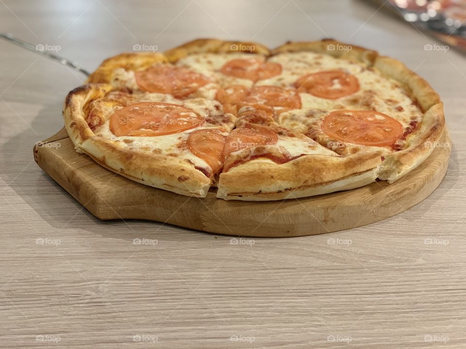 pizza with cheese and tomatoes
