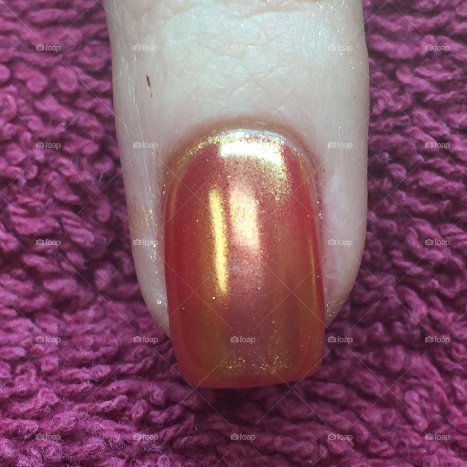 Orange chrome fingernail 