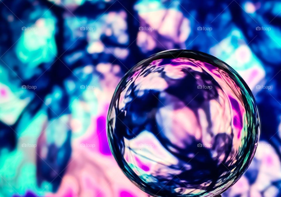 Part of a pattern I designed, displayed on a screen and photographed through a lens ball