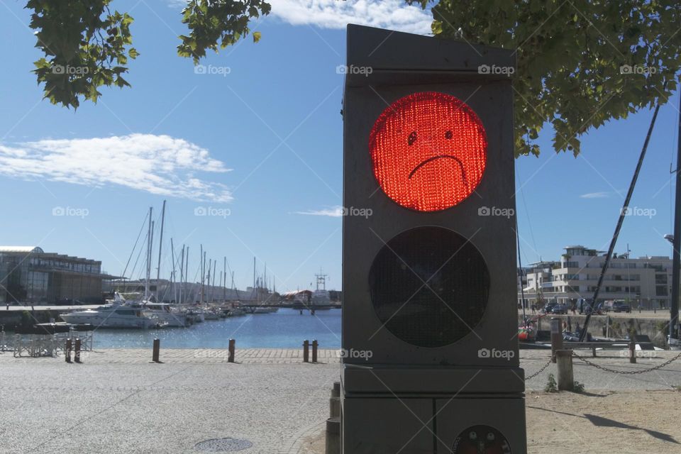 Sad Face on a Happy Summer Day in a French Coastal Town