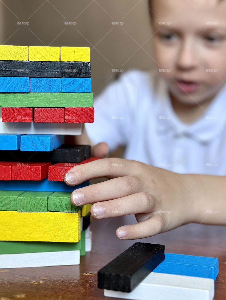 child playing jenga