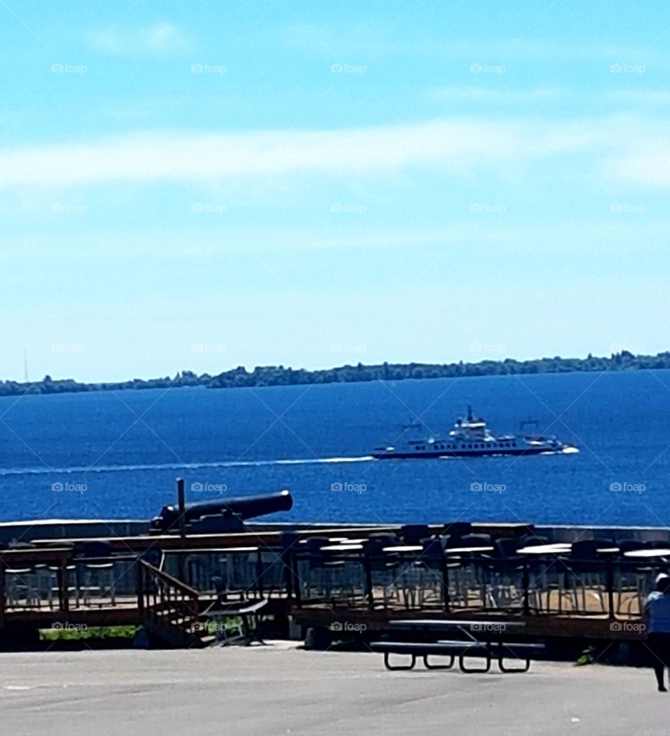 Large boat on the beautiful, crisp, clear, blue waters of Ottawa.