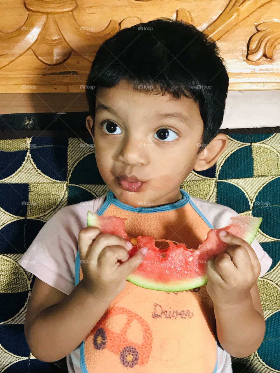 Summer remedies,my boy eating watermelon at summer time to refresh and get hydrated.