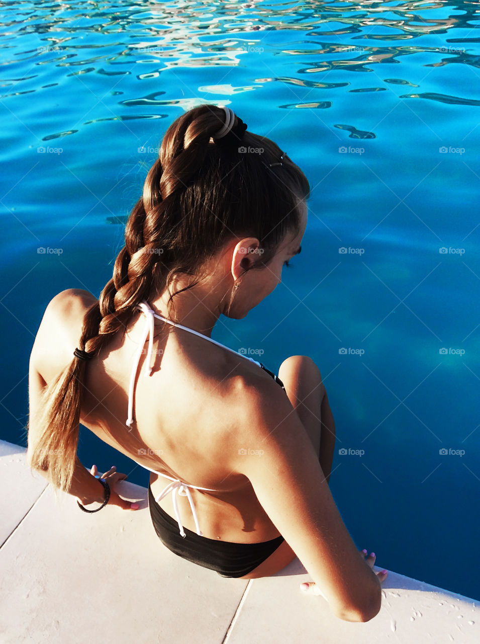 Enjoying the last summer days by the swimming pool 