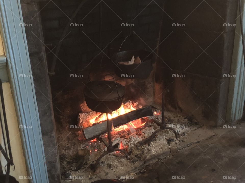 Old style cooking in a fireplace