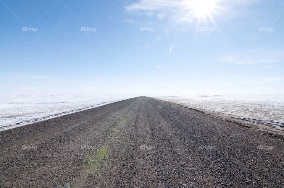 Inuvik-Tuktoyaktuk Highway in the Northwest Territories of Canada.  Well north of the Arctic Circle, this long, remote, desolate road connects the town of Inuvik to the hamlet of Tuktoyaktuk, which is the furthest north anyone can drive in Canada