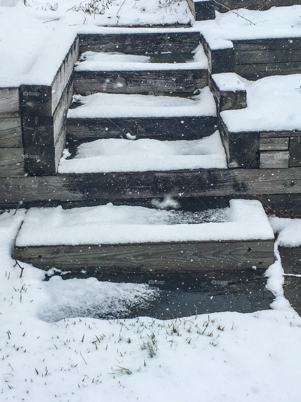 Snowy wooden stairs