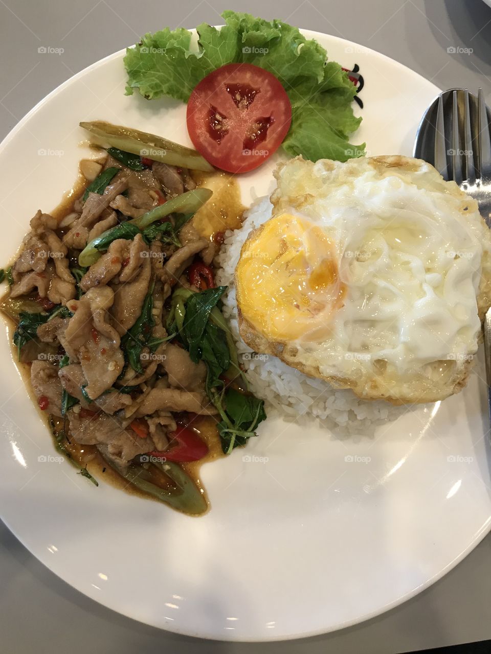Signature Thai food “Stir-fried pork and basil with Steamed rice”