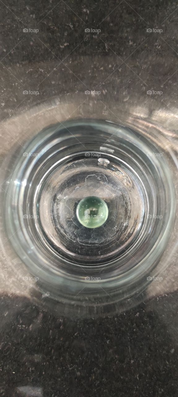 crystal ball under glass