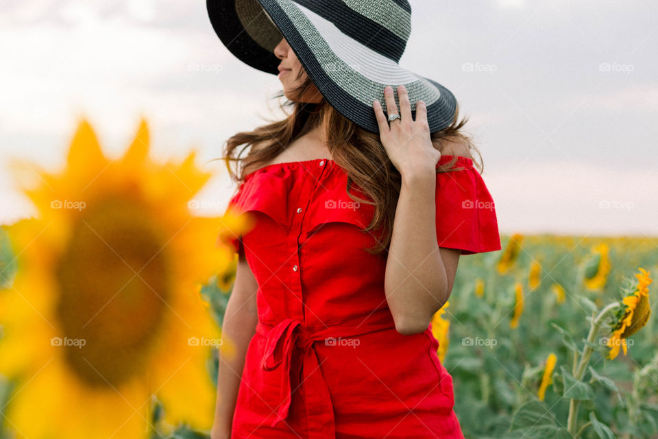 Girl in a sunflower field 