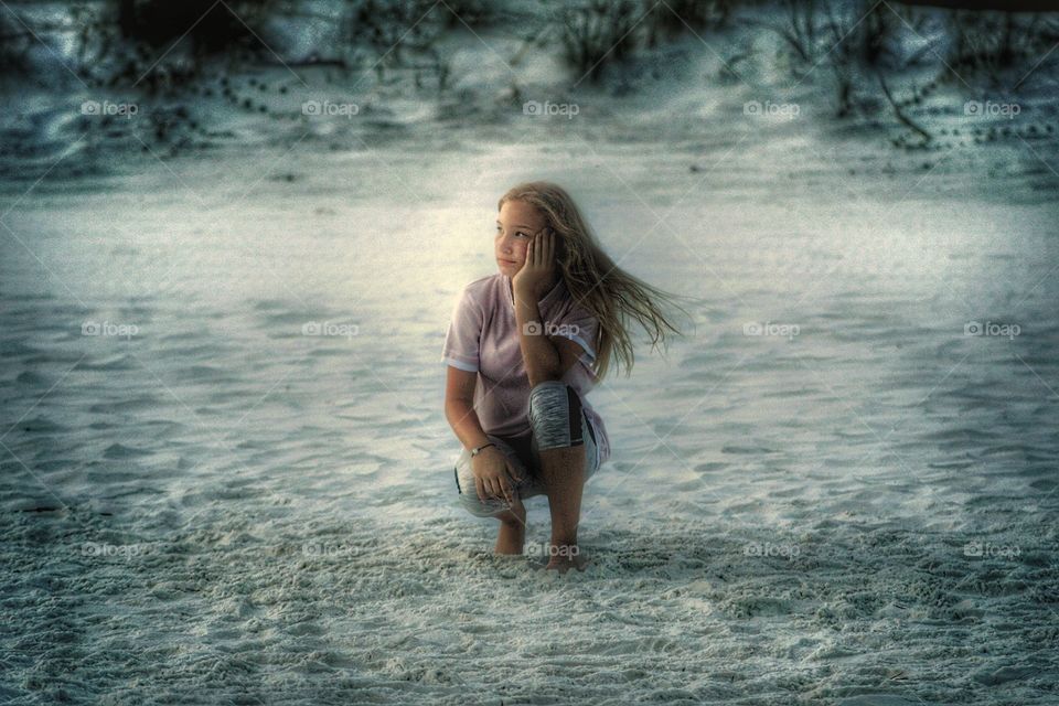 on a beach deep in thought