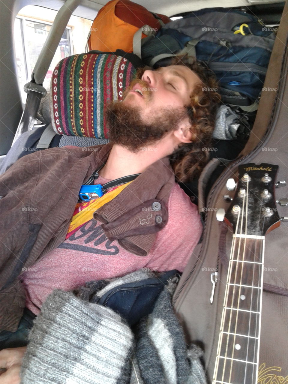 Traveler passed out in the backseat.