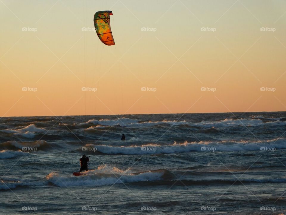waverider enjoying the sunset. waverider enjoying the sunset