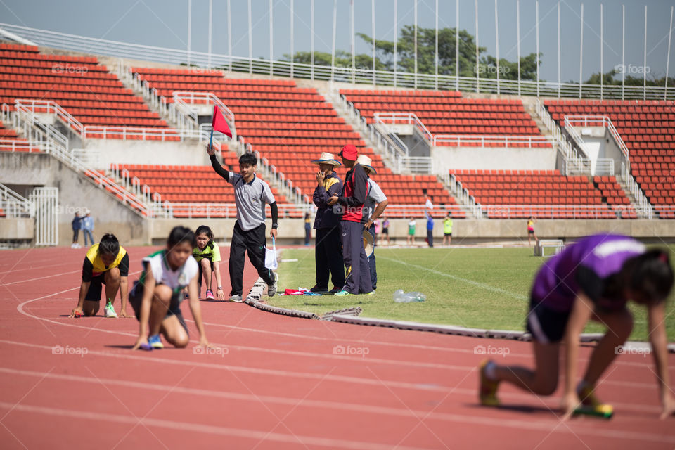 Athletic athlete in the track for the race