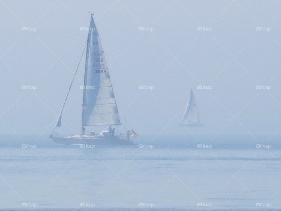 Sailboats in mist
