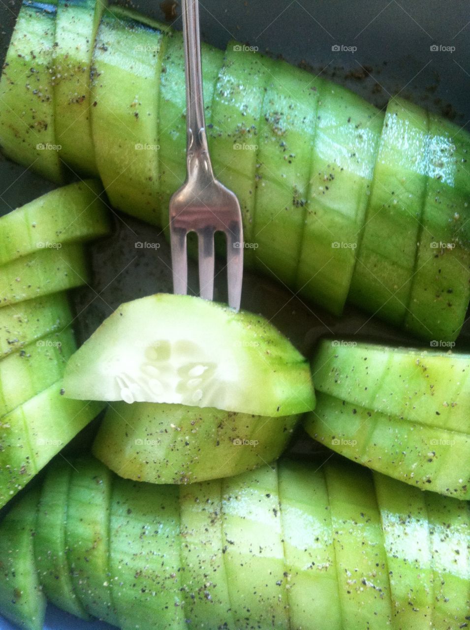 Cucumber. Sliced cucumber and fork