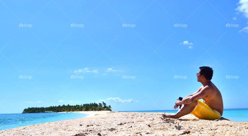 Man sitting on beach