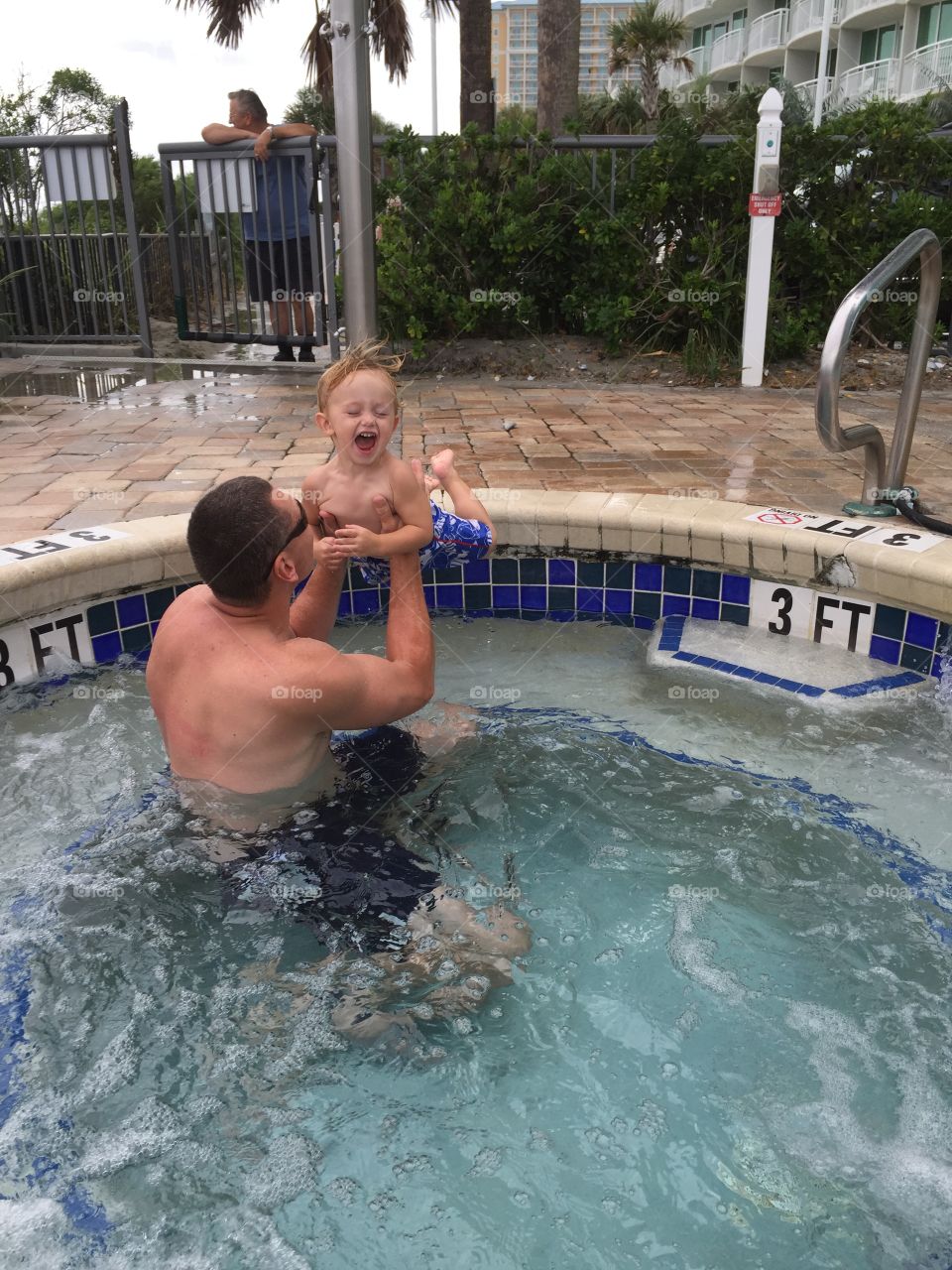 What's more fun than jumping into daddy's arms in the hot tub?