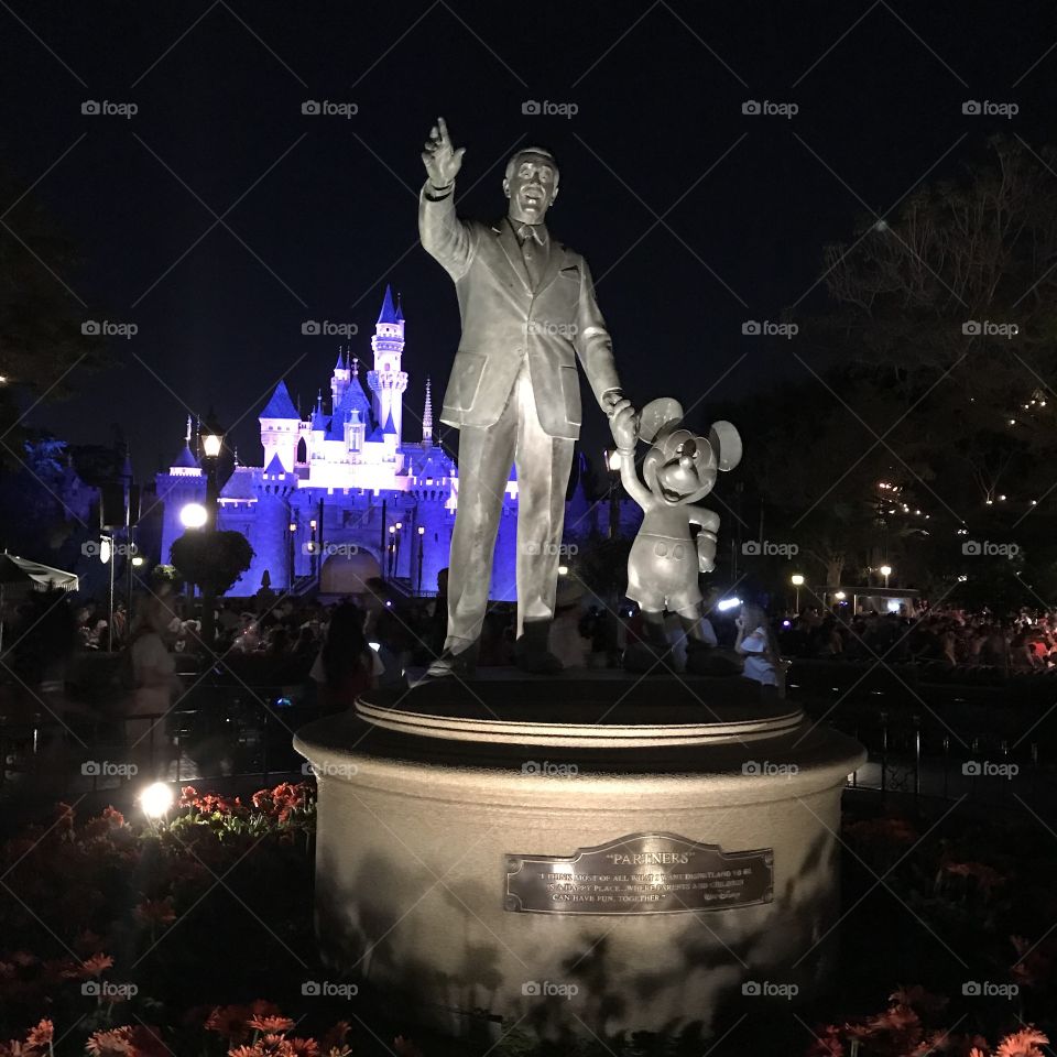 Nighttime Photo of the Partners Statue at Disneyland