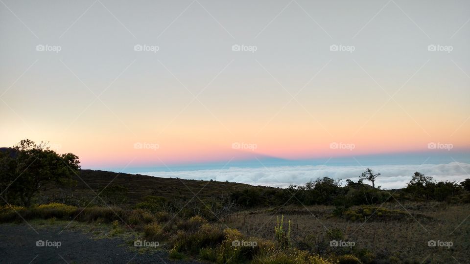 Mauna Kea descent through two cloud layers, Hawaii