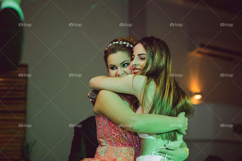 Close-up of two women hugging each other