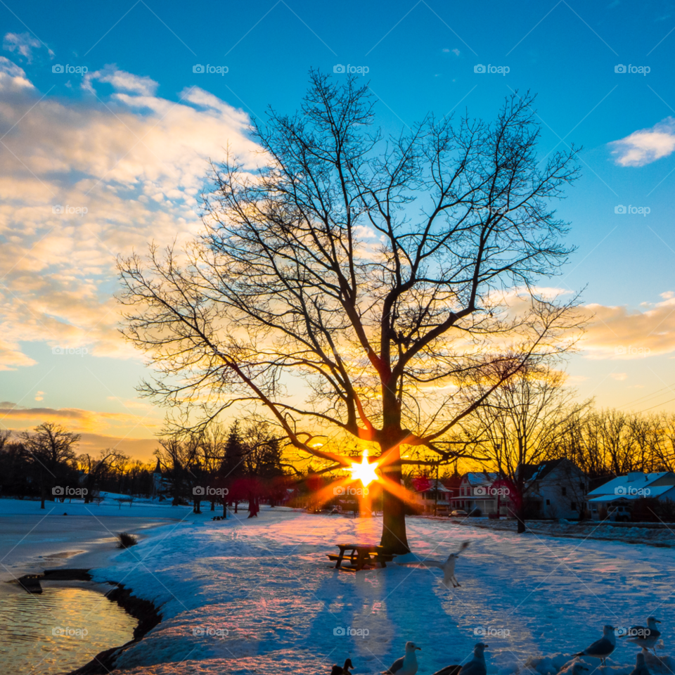 snow lake blue sky sun rays by delvec