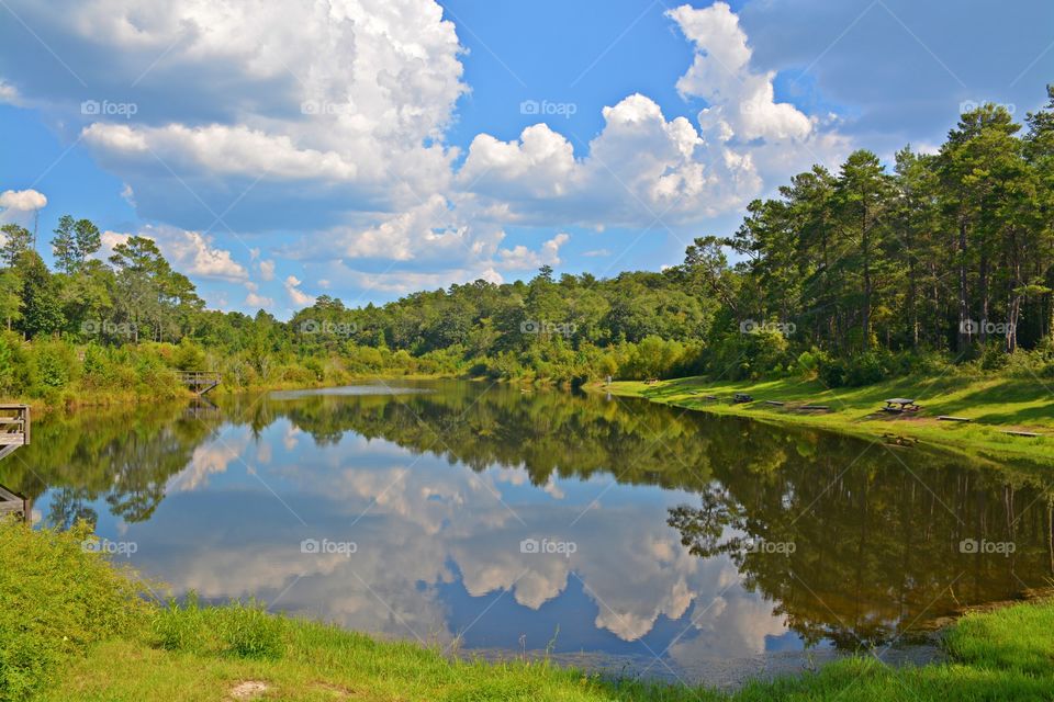 Seeing double - White puffy clouds and landscape reflection-patterns, texture, symmetry, asymmetry, depth of field, lines, curves, frames, contrast, color, viewpoint, depth, negative space, filled space, foreground, background, visual tension, shapes